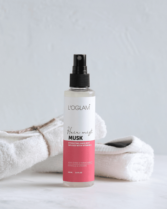 L’OGLAM Musk Hair Mist bottle with towel background